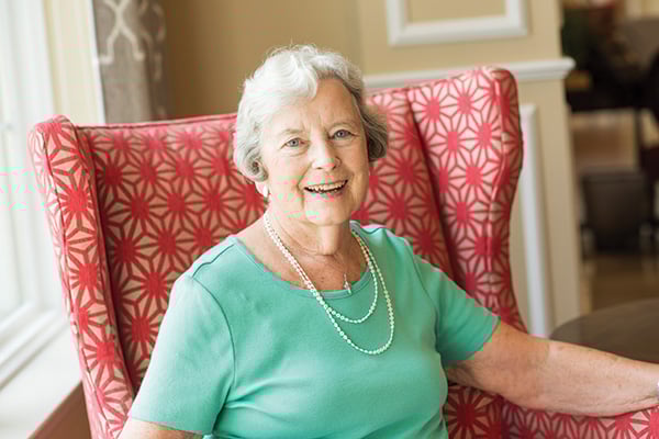 Cathedral Village Lady Sitting in Chair