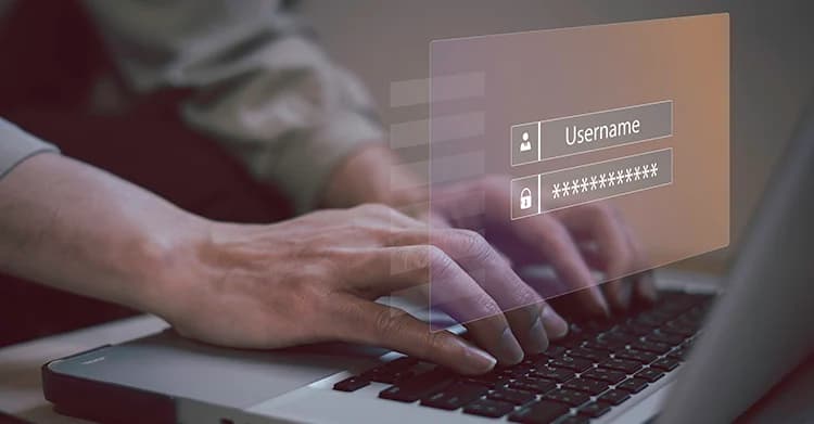 Hands on computer keyboard with username