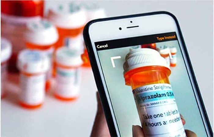 cell phone and pill bottles