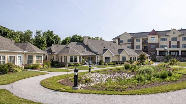Senior living cottages and apartment building in the background