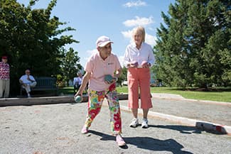 two senior women playing boules for lifelong fitnesss