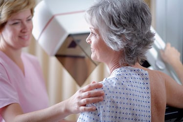 woman getting mammogram