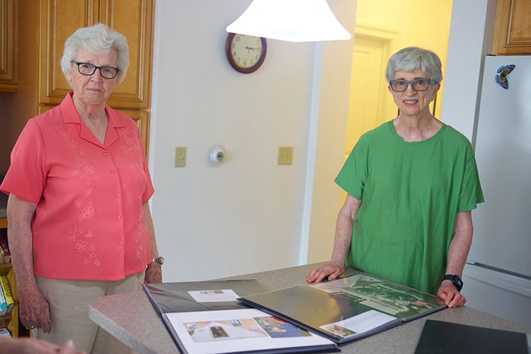 Two senior women displaying creative photography