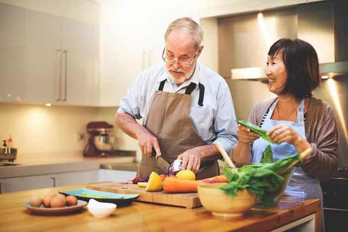Seniors preparing vegetables for dinner