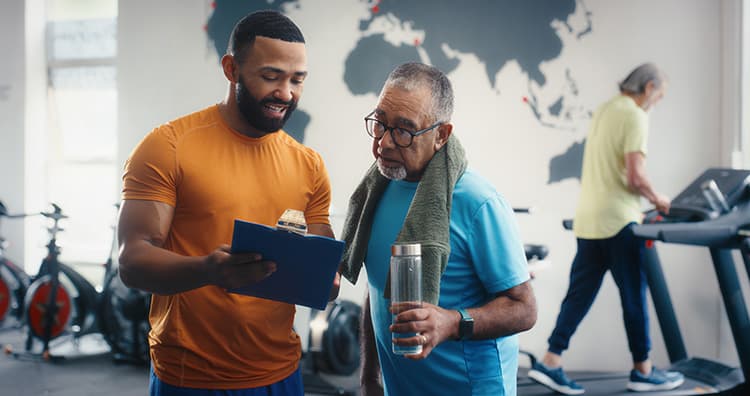 Two men with clipboard for healthy living goals
