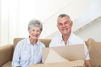 Senior woman and man with moving box, for senior living