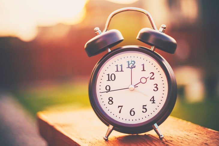 clock-sitting-on-fence