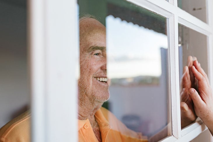family-window-visit-senior-care-during-covid19