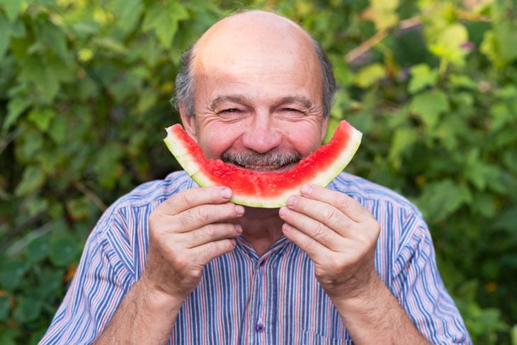 senior-man-smiling-with-watermelon
