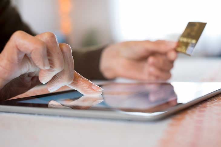 senior-online-shopping-on-ipad