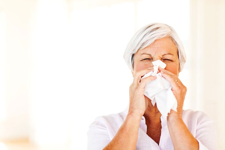 senior-woman-covering-her-sneeze