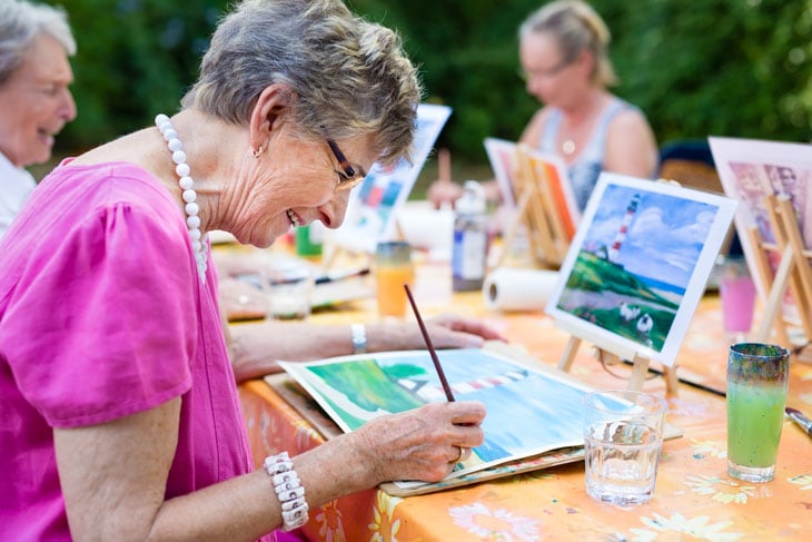 senior-woman-painting-with-friends