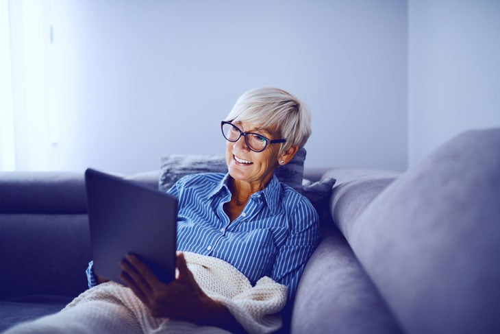 senior-woman-reading-ebook-technology-during-covid19