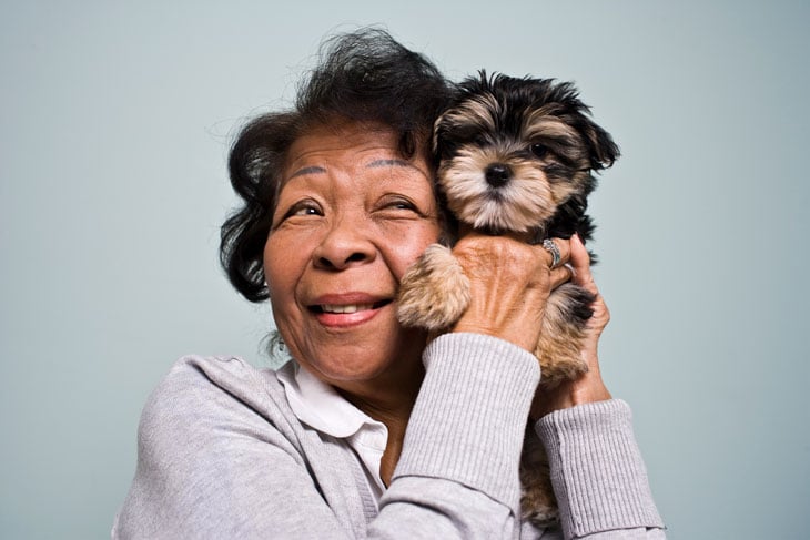 senior-woman-with-yorkie-puppy