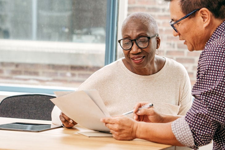 senior-woman-working-with-attorney-for-retirement-planning