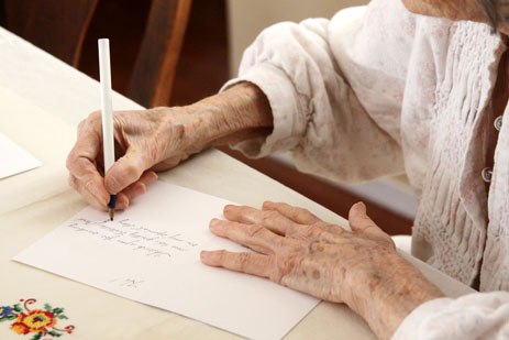 Senior woman writing letter