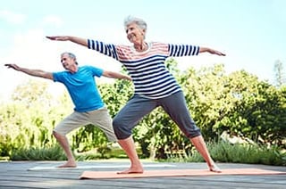 Senior man and senior woman doing tai chi for seniors