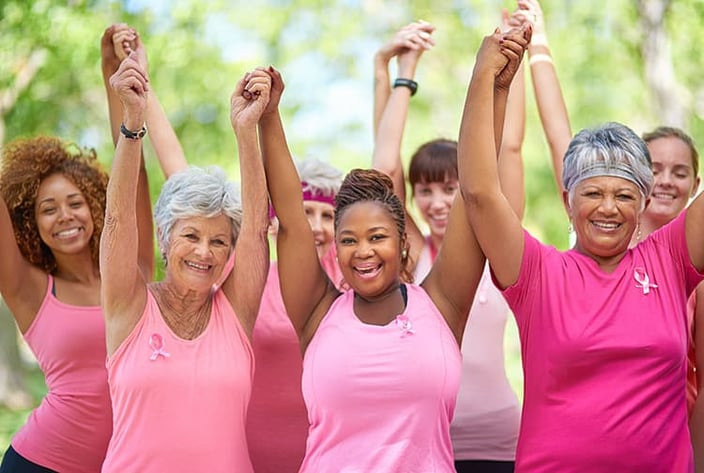 Women in pink shirts and womens on a walkathon