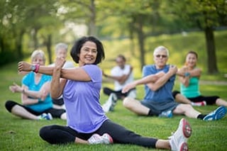 Woman doing yoga in senior living community