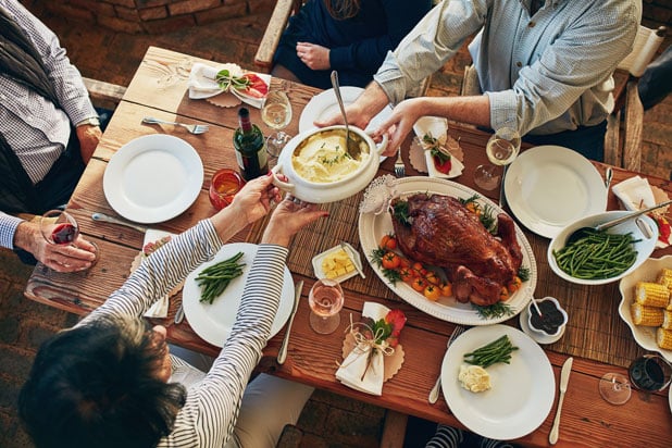 Passing food around Thanksgiving table