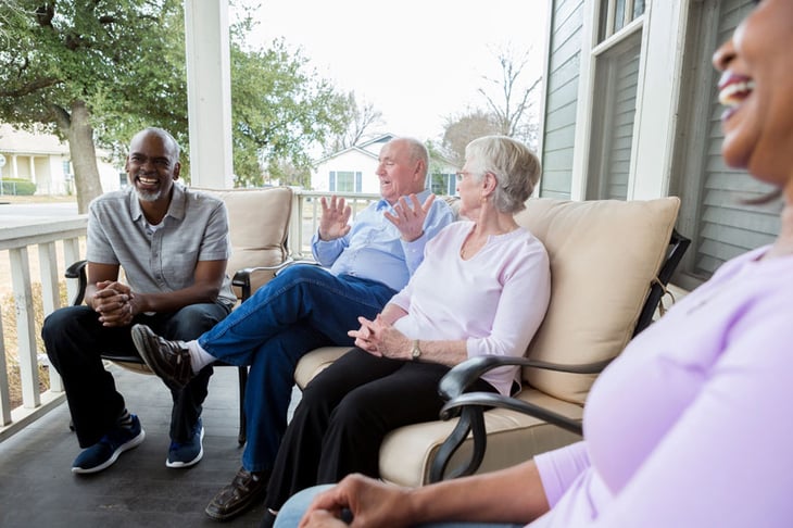 Seniors chatting on porch