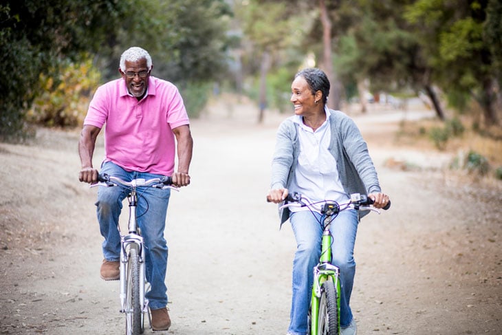 senior-man-and-woman-riding-bikes