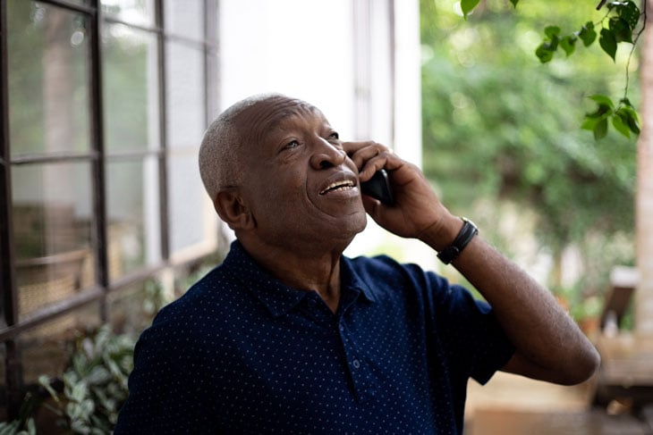 senior-man-with-dementia-talking-on-phone