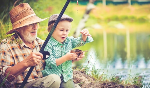 Grandpa and grandson fishing together